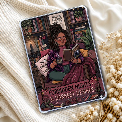 A clear phone case with a colorful illustrated design of a woman reading in a library, placed on a cream knit blanket with dried flowers. The design includes the text 'READING A DARKER CHAPTER', 'DARK PASSION IS ESSENTIAL', and 'FORBIDDEN NIGHTS & DARKEST DESIRES'.