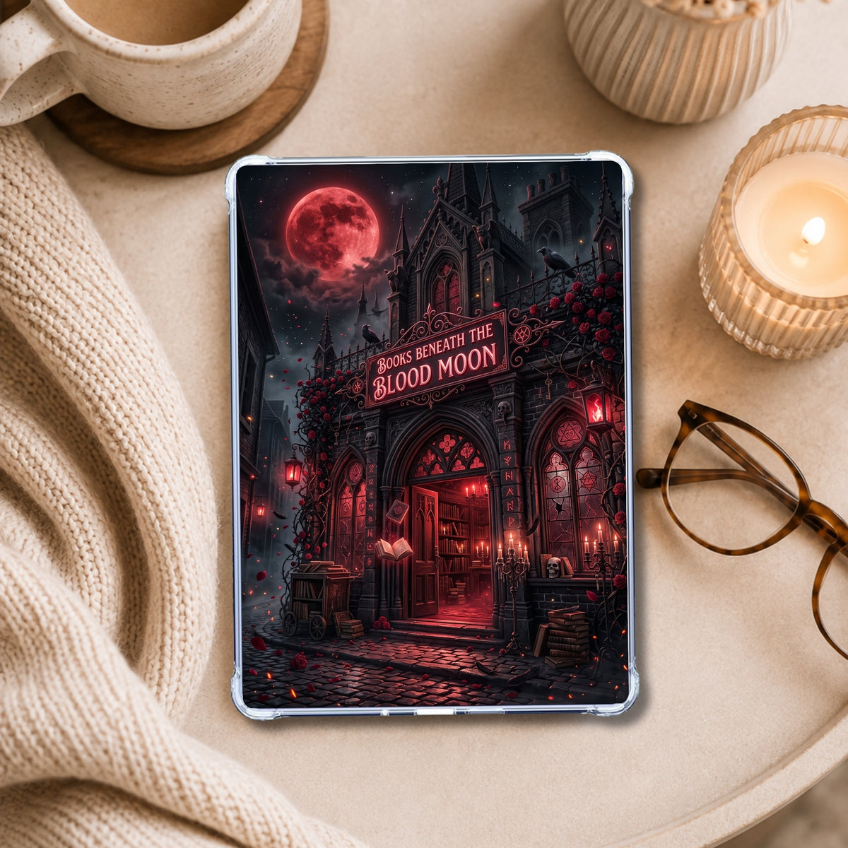 Books Beneath the Blood Moon shown on an eReader in a styled setting