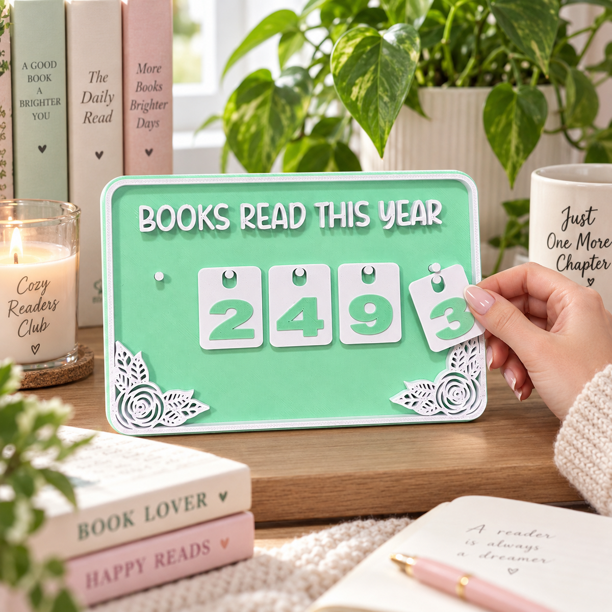 Hand placing a number tile on the green Reader’s Tally Board